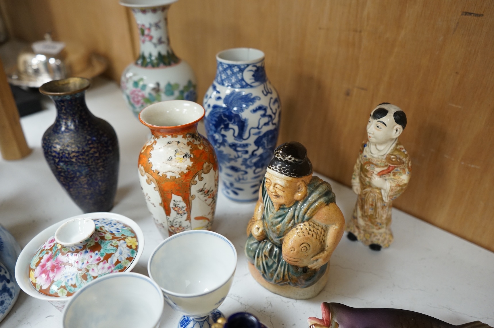 A collection of mostly Chinese and Japanese ceramics to include famille rose, satsuma, kutani etc. tallest 45cm